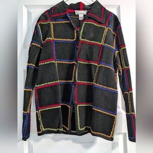 Black suede jacket with colored stitching.